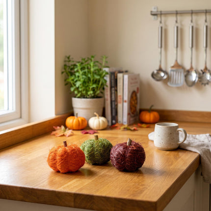 Three natural pumpkins in green, orange and dark red for terrarium decoration